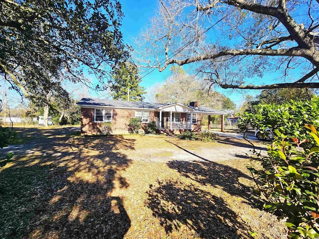 back of property with covered porch