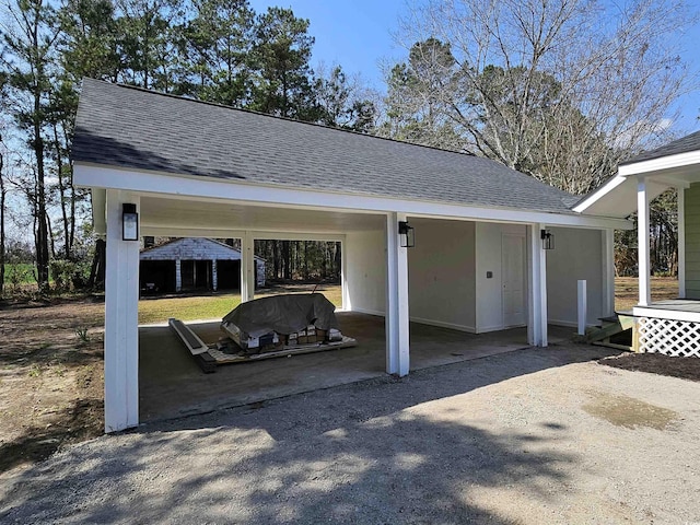 view of patio / terrace featuring a carport, a gazebo, and dirt driveway