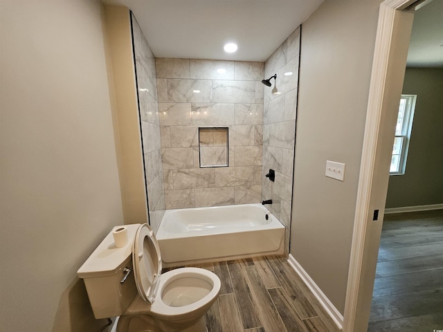 full bathroom with baseboards, toilet, shower / washtub combination, and wood tiled floor