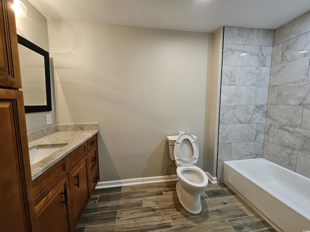 full bath with baseboards, toilet, vanity, and wood tiled floor