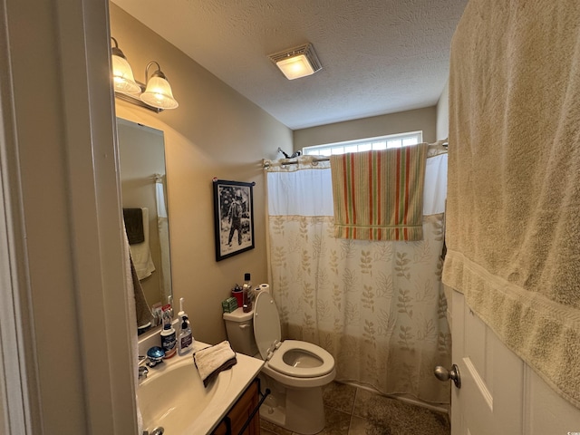 full bath with tile patterned flooring, toilet, a sink, and a textured ceiling