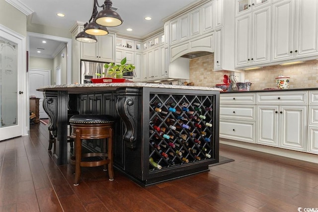9785 Anchor Dr, Longs, SC 29568 - bar with stainless steel fridge, dark wood-type flooring, tasteful backsplash, hanging light fixtures, and crown molding