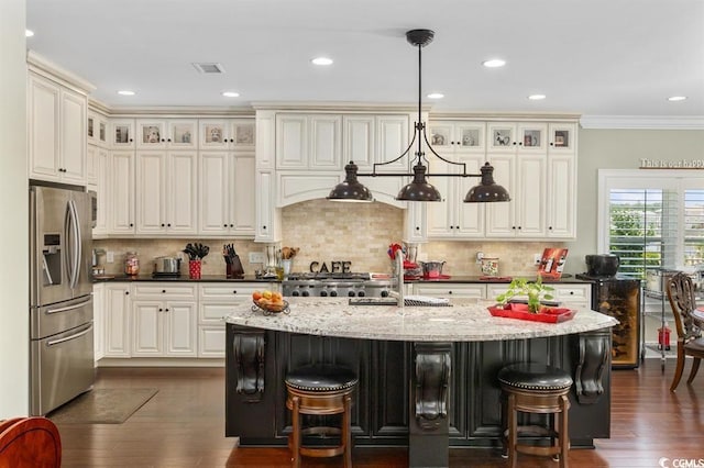 9785 Anchor Dr, Longs, SC 29568 - kitchen with stainless steel fridge, a sink, a breakfast bar, dark wood-style flooring, and recessed lighting