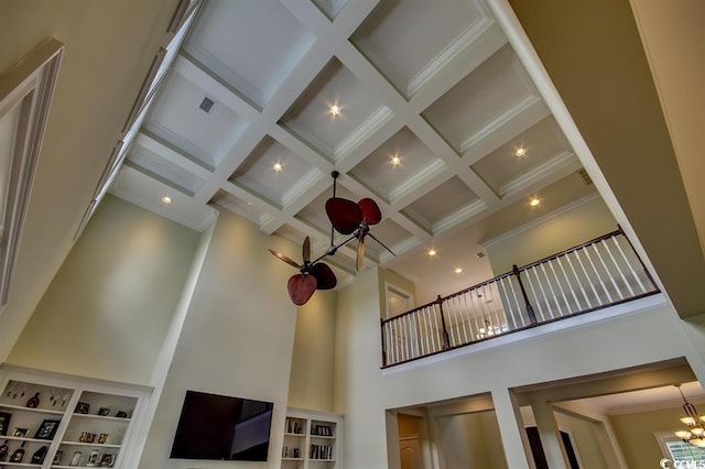 9785 Anchor Dr, Longs, SC 29568 - detailed view of a chandelier, coffered ceiling, beamed ceiling, and crown molding
