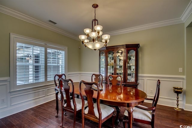 9785 Anchor Dr, Longs, SC 29568 - dining room featuring ornamental molding, a chandelier, dark wood-type flooring, and wainscoting