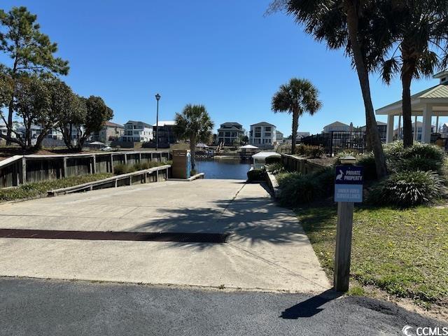9785 Anchor Dr, Longs, SC 29568 - view of street featuring a boat ramp, street lighting, and a water view