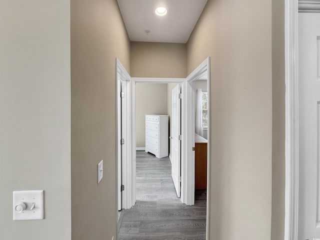 corridor featuring wood finished floors