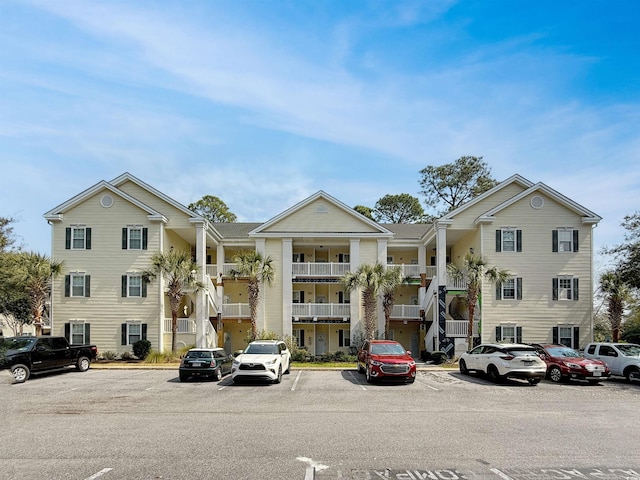 view of property with uncovered parking