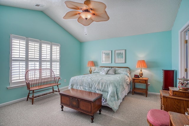 bedroom featuring baseboards, lofted ceiling, and carpet