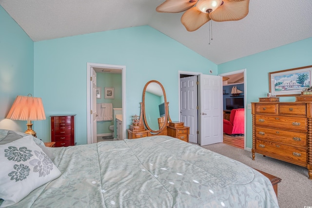 carpeted bedroom with ensuite bathroom, a closet, ceiling fan, a spacious closet, and vaulted ceiling