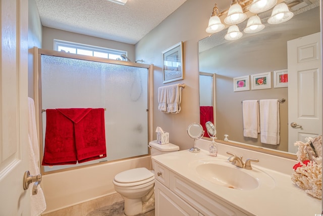 bathroom featuring combined bath / shower with glass door, toilet, a textured ceiling, and vanity