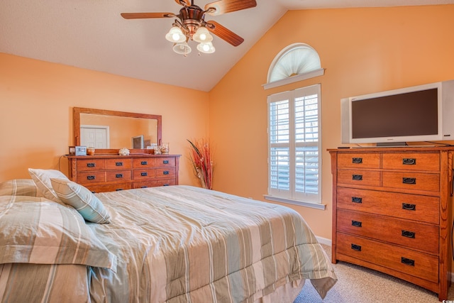 bedroom with light carpet, a ceiling fan, and lofted ceiling