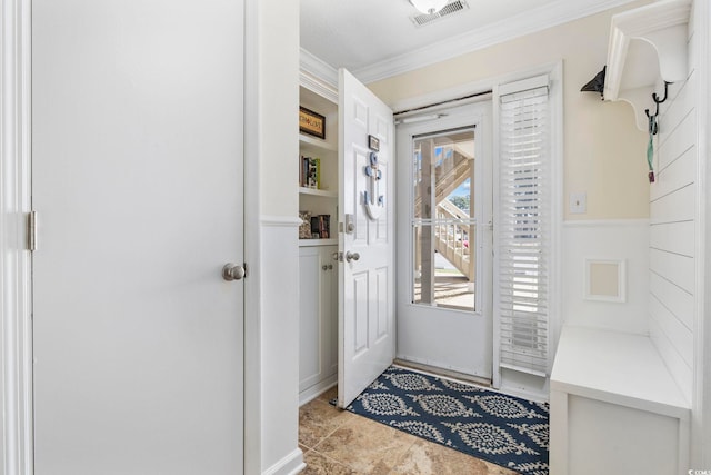 entryway featuring visible vents and crown molding