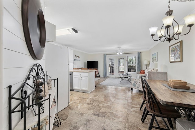 dining space with crown molding and ceiling fan with notable chandelier