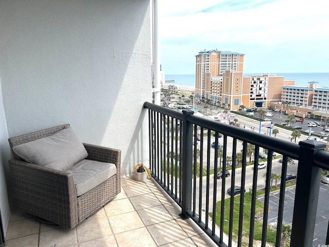 balcony featuring a view of city and a water view