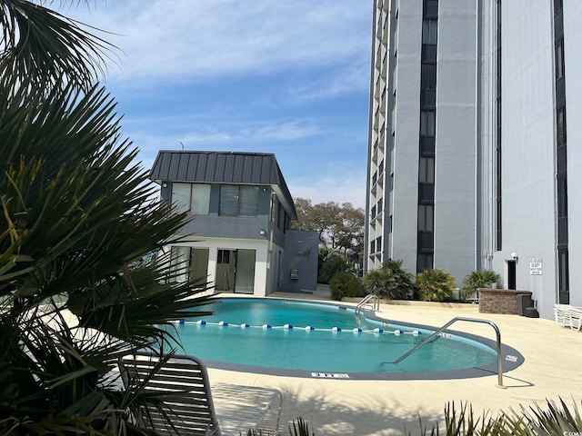 pool with a patio