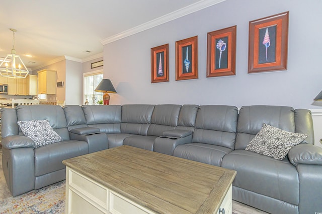 living area with an inviting chandelier and ornamental molding