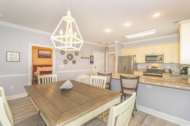 dining space with visible vents, baseboards, ornamental molding, light wood-style flooring, and a notable chandelier