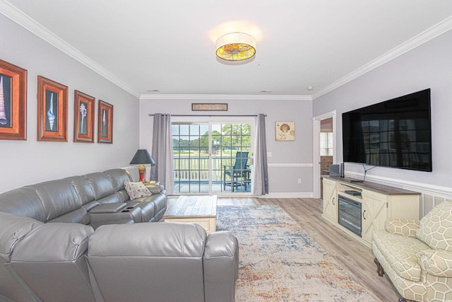 living area with light wood finished floors, crown molding, and baseboards