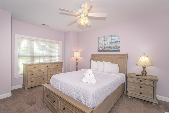 bedroom featuring a ceiling fan, carpet flooring, baseboards, and visible vents