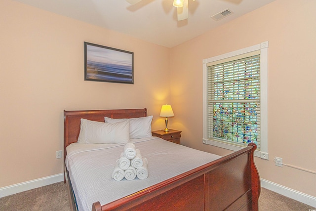 bedroom featuring a ceiling fan, baseboards, visible vents, and carpet floors