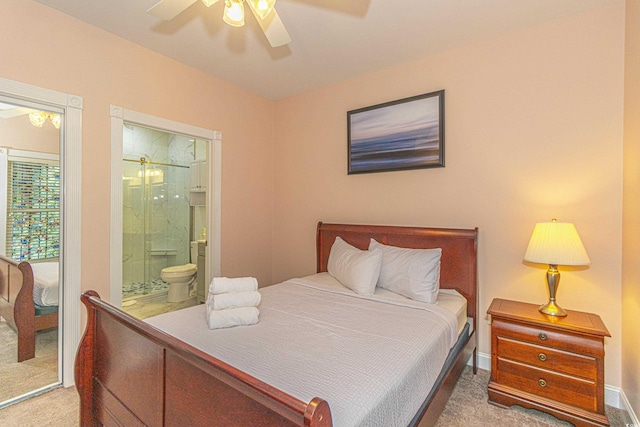 carpeted bedroom with connected bathroom and a ceiling fan