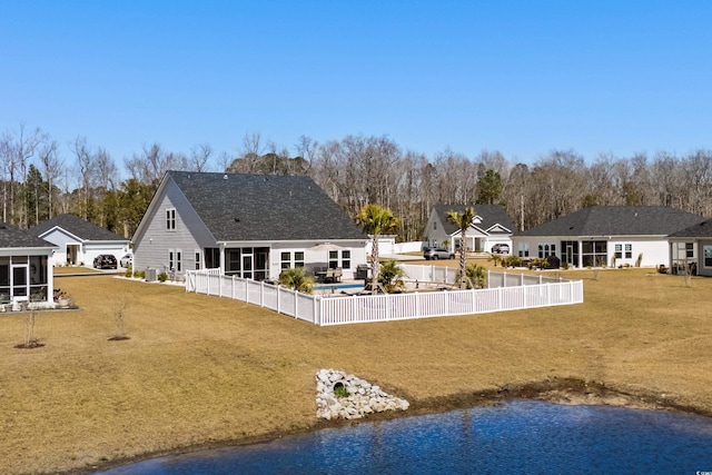 exterior space with a sunroom, a fenced backyard, and a patio area