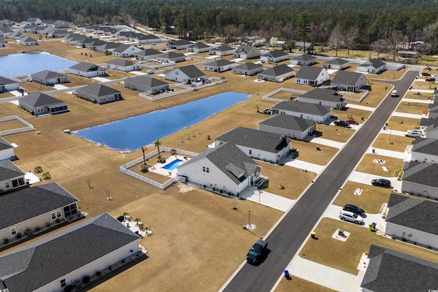 aerial view with a residential view and a water view