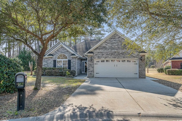 view of front of house featuring brick siding, an attached garage, and concrete driveway