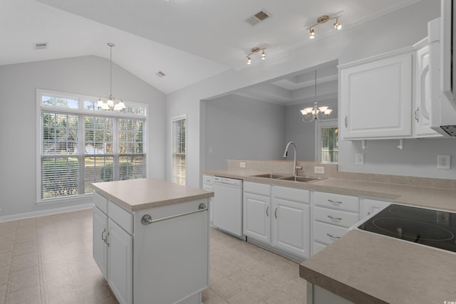 kitchen featuring visible vents, light floors, a notable chandelier, white appliances, and a sink