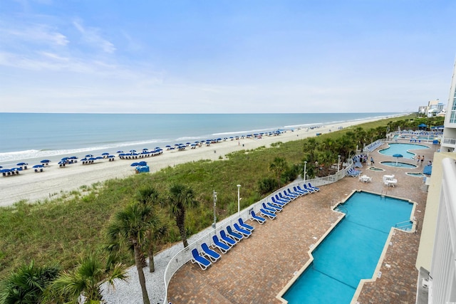 bird's eye view with a beach view and a water view