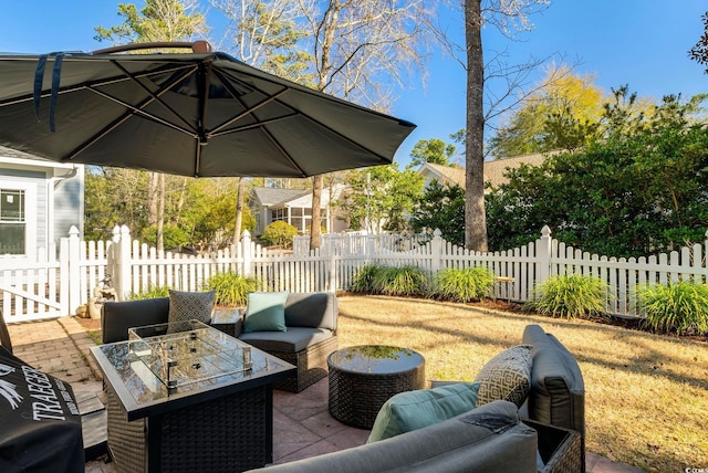 view of patio / terrace with an outdoor living space and fence