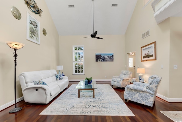 living area with a healthy amount of sunlight, visible vents, and high vaulted ceiling