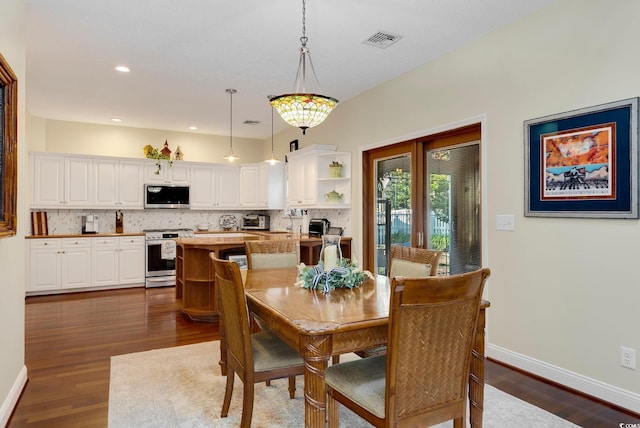 dining space with baseboards, visible vents, a toaster, recessed lighting, and dark wood-type flooring