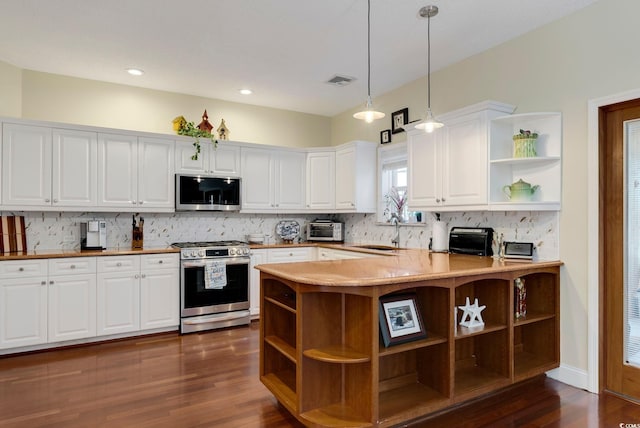 kitchen with open shelves, a sink, white cabinets, appliances with stainless steel finishes, and tasteful backsplash