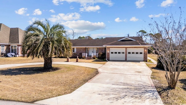 view of front of property featuring brick siding, an attached garage, and concrete driveway