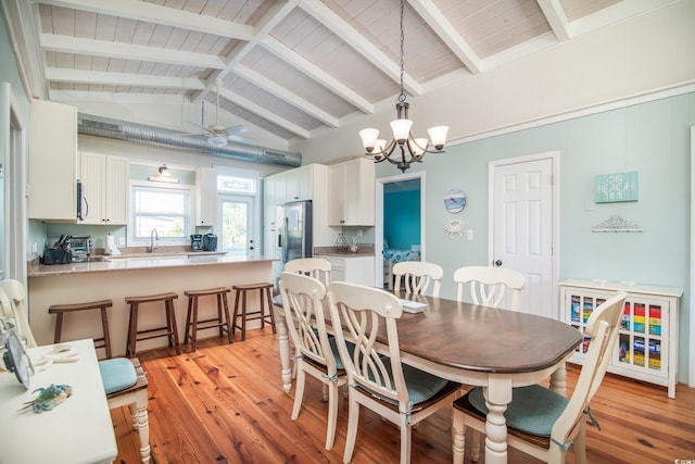 162 Norris Dr, Pawleys Island, SC 29585 - dining area featuring light wood-style flooring, wooden ceiling, lofted ceiling with beams, and an inviting chandelier