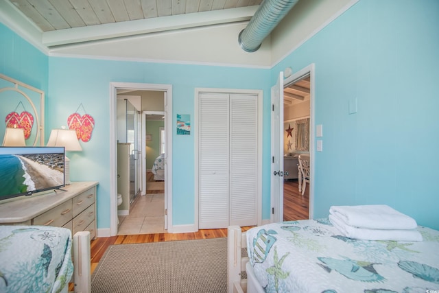 162 Norris Dr, Pawleys Island, SC 29585 - bedroom featuring beamed ceiling, baseboards, a closet, and light wood-type flooring
