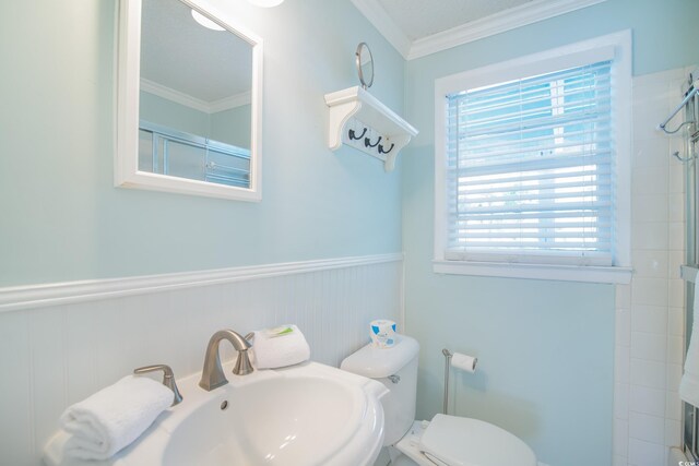 162 Norris Dr, Pawleys Island, SC 29585 - full bath with a sink, a wainscoted wall, ornamental molding, and a tile shower