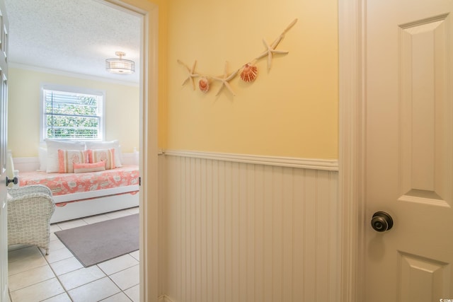 162 Norris Dr, Pawleys Island, SC 29585 - bathroom with tile patterned flooring, a textured ceiling, and ornamental molding