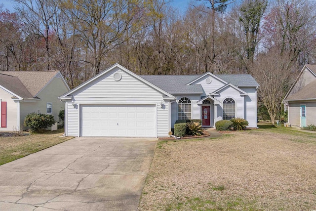 ranch-style home featuring a front lawn, a garage, driveway, and roof with shingles