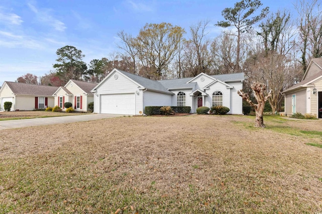 view of front of property with a front lawn, an attached garage, and driveway