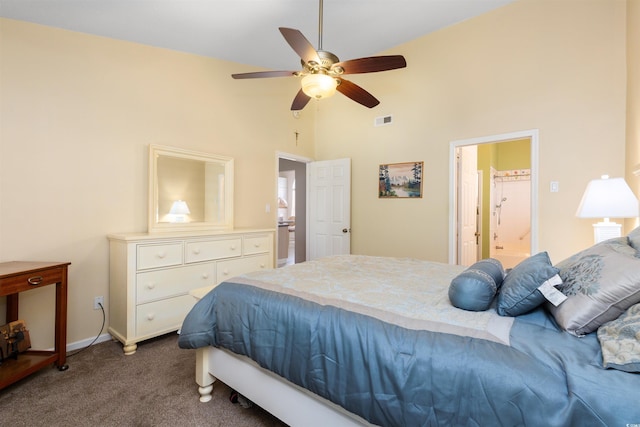 bedroom with a ceiling fan, visible vents, carpet floors, high vaulted ceiling, and ensuite bath