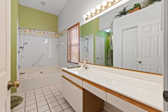 full bath featuring tile patterned flooring, vanity, and bathing tub / shower combination