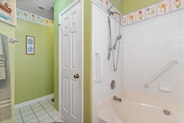 bathroom with tile patterned flooring, visible vents, a textured ceiling, and shower / bathtub combination