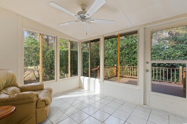 unfurnished sunroom featuring lofted ceiling and a ceiling fan