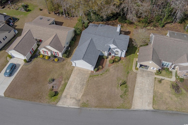 birds eye view of property with a residential view