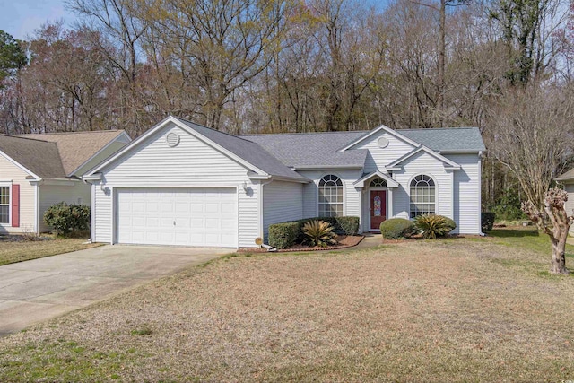 ranch-style house featuring a front yard, a garage, driveway, and roof with shingles