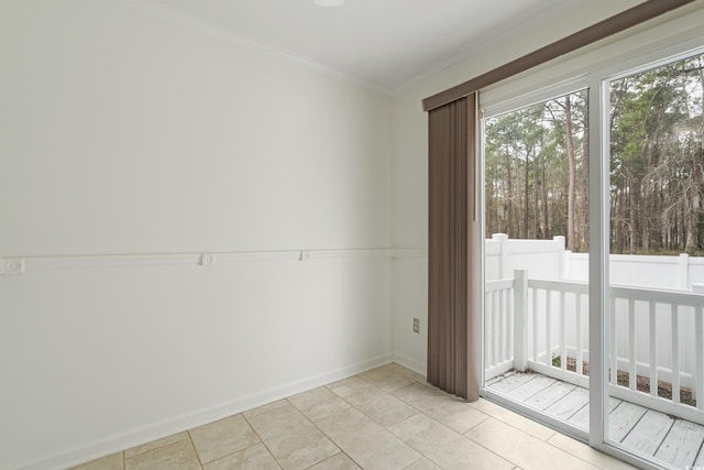 empty room featuring baseboards, light tile patterned flooring, and crown molding