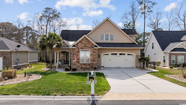 craftsman inspired home featuring concrete driveway, an attached garage, a front yard, and stone siding